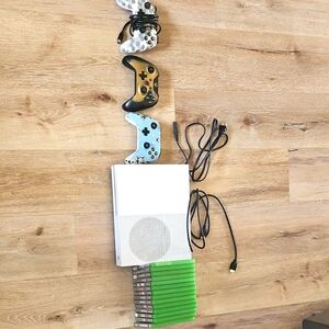 White Gaming Console with Controllers and Games